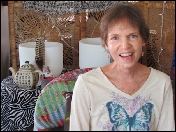 Woman smiling sitting by table